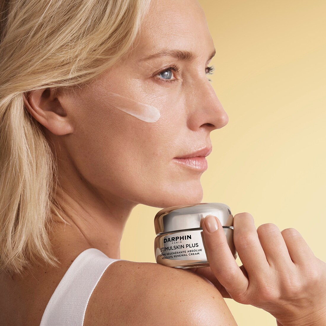 Woman holding skincare product